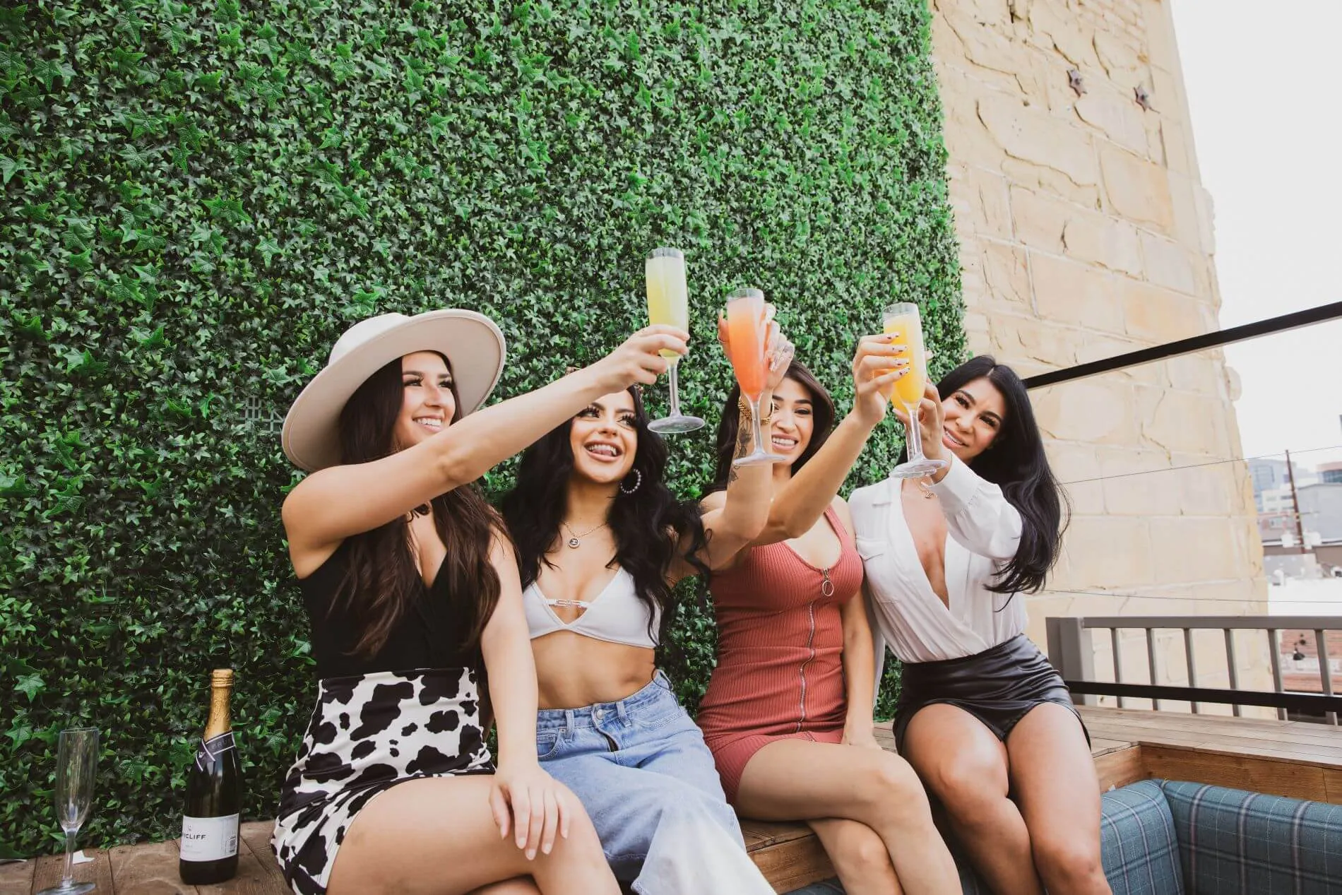 girls at dierks bentley whiskey row denver country bar and restaurant enjoying mimosas on the patio