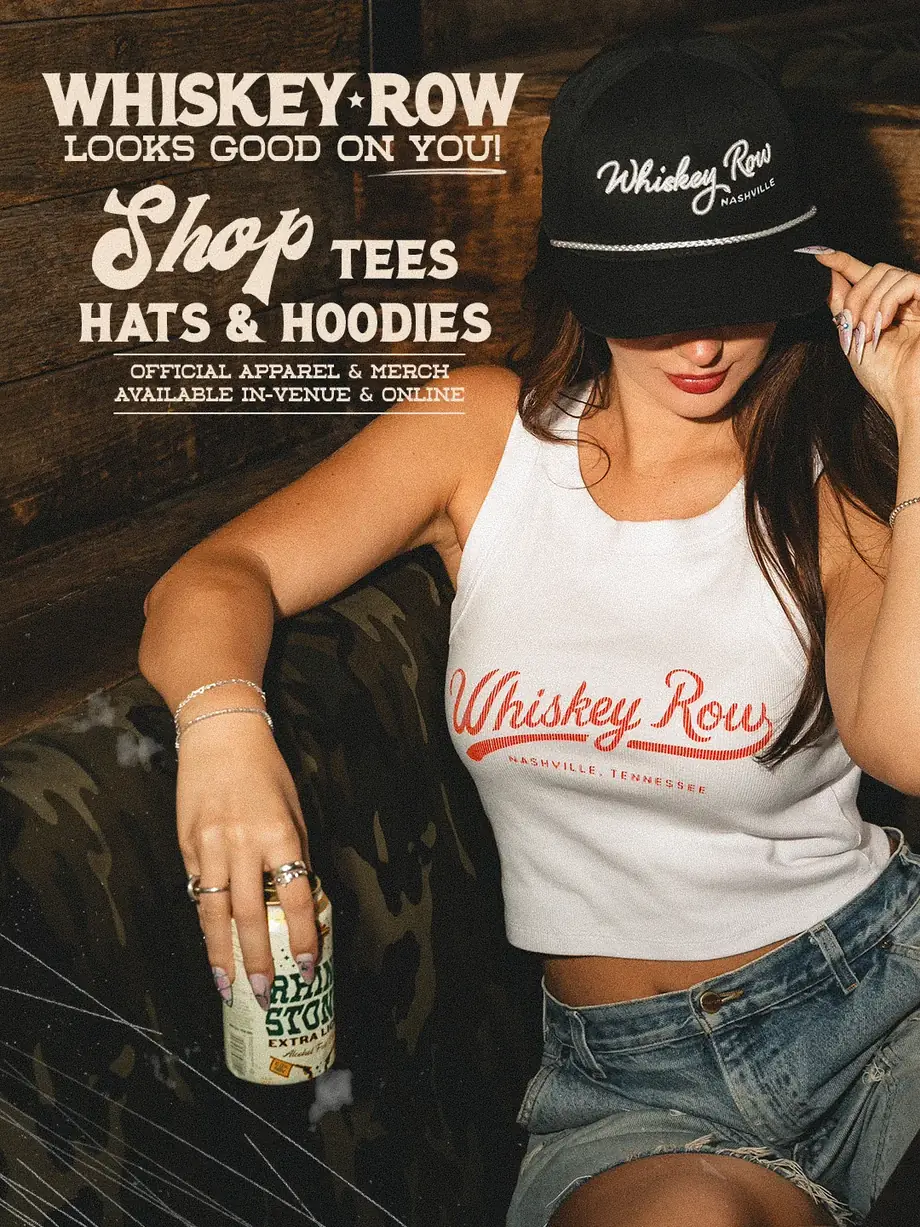 Whiskey Row looks good on you! Shop tees, hats and hoodies. Official apparel and merch available in-venue and online. A woman wearing a black Whiskey Row Nashville hat and a white Whiskey Row Nashville tank top.